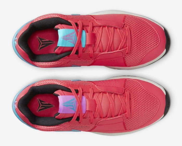 View of Ja Morant's red, blue, and white Nike shoes.